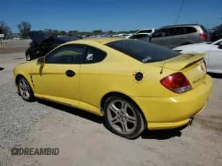 2006 Hyundai Tiburon GT z VIN KMHHN65F96U203308, wystawiony jako Copart lot #47278684 z przebiegiem 186 123 mil mil oraz Szkoda całkowita • Salvage title. Historia ofert i sprzedaży dostępna na DreamBid. Obrazek 2.