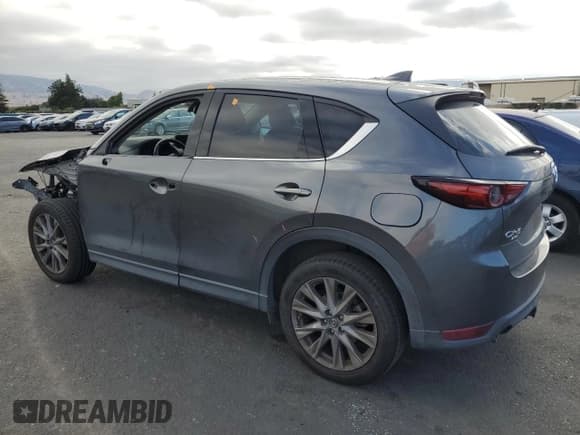 ✅ 2020 Mazda CX-5 Grand Touring Reserve • VIN: JM3KFBAY8L0818952 • Lot: 85185415. Listed on Copart with 57,282 mi. Free auction sales archive from the USA and detailed vehicle history report at DreamBid. Image 2.