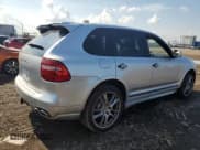 ✅ 2009 Porsche Cayenne GTS • VIN: WP1AD29P39LA61423 • Лот: 66403895. Опубликован ранее на Copart с пробегом 177 629 миль. Бесплатный доступ к архиву аукционных продаж из США и подробный отчёт об истории автомобиля на DreamBid. Изображение 3.