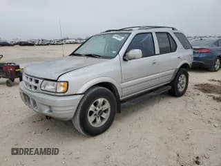 ✅ 2000 Isuzu Rodeo S • VIN: 4S2CK58W8Y4351180 • Lot: 44648595. Listed on Copart with 375,829 mi. Free auction sales archive from the USA and detailed vehicle history report at DreamBid. Image 1.