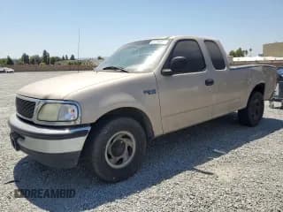 ✅ 1998 Ford F-150 • VIN: 1FTZX1729WKC18712 • Lot: 67794465. Listed on Copart with 326,008 mi. Free auction sales archive from the USA and detailed vehicle history report at DreamBid. Image 1.