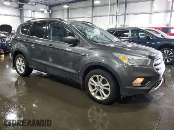2018 Ford Escape SE с VIN 1FMCU9GD3JUB57039, выставлен на аукционе Copart как лот 65642995 с пробегом 154 325 миль миль и Списание • Salvage title. История ставок и продаж доступна на DreamBid. Изображение 4.