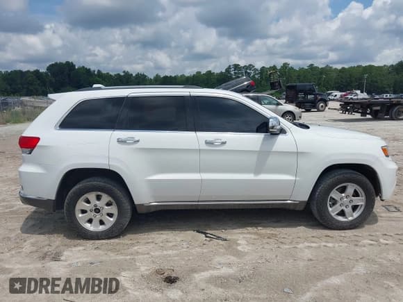 ✅ 2015 Jeep Grand Cherokee • VIN: 1C4RJEJM8FC674648 • Lot: 42785823. Listed on IAAI with 207,084 mi. Free auction sales archive from the USA and detailed vehicle history report at DreamBid. Image 13.