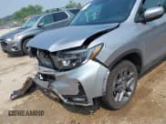 ✅ 2023 Honda Passport EX-L • VIN: 5FNYF8H50PB019594 • Lot: 42882366. Listed on IAAI with 26,120 mi. Free auction sales archive from the USA and detailed vehicle history report at DreamBid. Image 18.