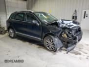 ✅ 2014 Volkswagen Touareg Sport • VIN: WVGEF9BP0ED008887 • Lot: 71643635. Listed on Copart with 233,433 mi. Free auction sales archive from the USA and detailed vehicle history report at DreamBid. Image 4.