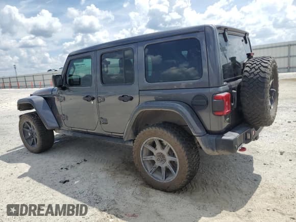 ✅ 2021 Jeep Wrangler Unlimited Rubicon • VIN: 1C4JJXFM8MW701876 • Lot: 65555315. Wystawiony na Copart z przebiegiem 100 411 mil. Bezpłatny archiwum sprzedaży aukcyjnych z USA i szczegółowy raport historii pojazdu na DreamBid. Zdjęcie 2.
