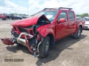 ✅ 2012 Nissan Frontier Pro-4X • VIN: 1N6AD0EV3CC439870 • Lot: 42269470. Listed on IAAI with 165,597 mi. Free auction sales archive from the USA and detailed vehicle history report at DreamBid. Image 2.