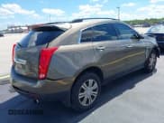 ✅ 2015 Cadillac SRX • VIN: 3GYFNAE35FS642004 • Lot: 42263470. Listed on IAAI with 94,968 mi. Free auction sales archive from the USA and detailed vehicle history report at DreamBid. Image 4.