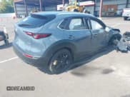 ✅ 2025 Mazda CX-30 S Carbon Edition • VIN: 3MVDMBCM7SM796485 • Лот: 43187011. Опубликован ранее на IAAI с пробегом 15 145 миль. Бесплатный доступ к архиву аукционных продаж из США и подробный отчёт об истории автомобиля на DreamBid. Изображение 4.
