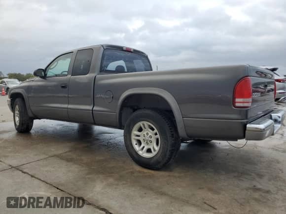 2003 Dodge Dakota SLT с VIN 1D7HL42X73S247297, выставлен на аукционе Copart как лот 80992814 с пробегом Не указан миль и Списание • Salvage title. История ставок и продаж доступна на DreamBid. Изображение 2.