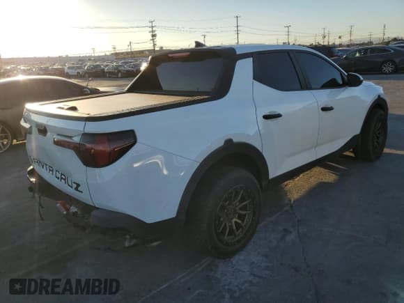 ✅ 2022 Hyundai Santa Cruz SEL • VIN: 5NTJBDAE5NH001866 • Lot: 90853285. Listed on Copart with 49,387 mi. Free auction sales archive from the USA and detailed vehicle history report at DreamBid. Image 3.