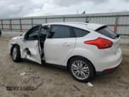 ✅ 2016 Ford Focus Titanium • VIN: 1FADP3N27GL242243 • Лот: 90424575. Опубликован ранее на Copart с пробегом 58 813 миль. Бесплатный доступ к архиву аукционных продаж из США и подробный отчёт об истории автомобиля на DreamBid. Изображение 2.