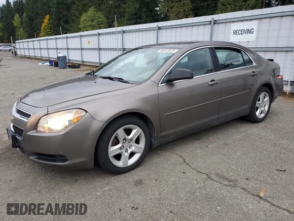 ✅ 2012 Chevrolet Malibu 1LS • VIN: 1G1ZB5E09CF150285 • Lot: 86843625. Listed on Copart with 129,115 mi. Free auction sales archive from the USA and detailed vehicle history report at DreamBid. Image 1.