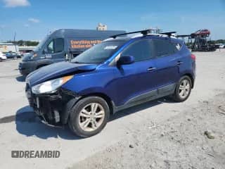 2011 Hyundai Tucson GLS z VIN KM8JU3AC3BU124953, wystawiony jako Copart lot #70328355 z przebiegiem 150 166 mil mil oraz Szkoda całkowita • Salvage title. Historia ofert i sprzedaży dostępna na DreamBid. Obrazek 1.