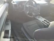 ✅ 2009 Dodge Challenger SE • VIN: 2B3LJ44V69H515716 • Lot: 70335234. Wystawiony na Copart z przebiegiem 255 192 mil. Bezpłatny archiwum sprzedaży aukcyjnych z USA i szczegółowy raport historii pojazdu na DreamBid. Zdjęcie 8.