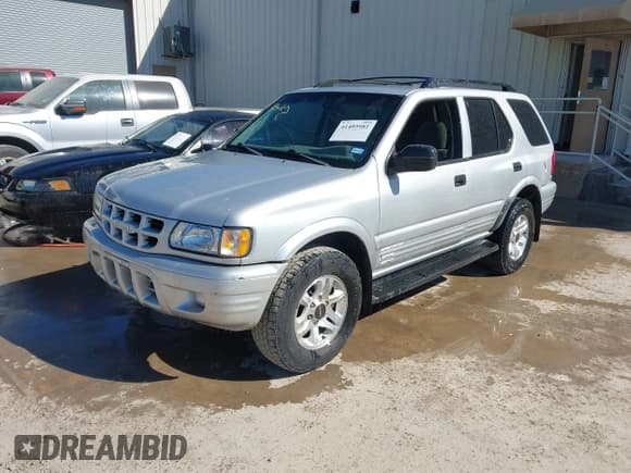 ✅ 2002 Isuzu Rodeo S • VIN: 4S2CK58WX24321556 • Lot: 41405981. Listed on IAAI with 172,590 mi. Free auction sales archive from the USA and detailed vehicle history report at DreamBid. Image 2.