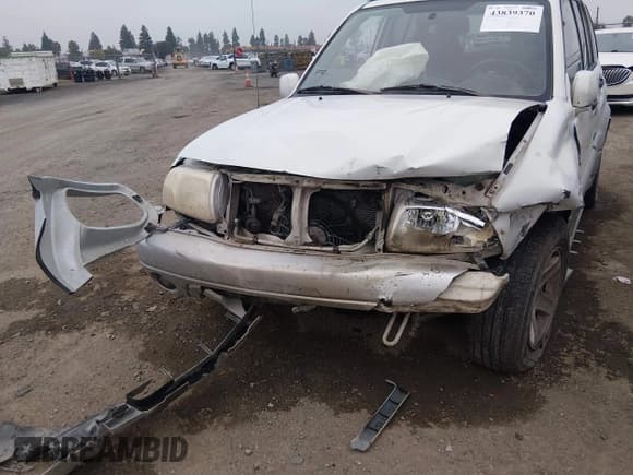 ✅ 2003 Suzuki Grand Vitara • VIN: JS3TE62VX34100454 • Lot: 43839370. Listed on IAAI with 198,777 mi. Free auction sales archive from the USA and detailed vehicle history report at DreamBid. Image 6.