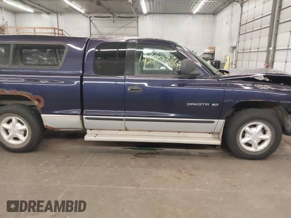 1998 Dodge Dakota SLT with VIN 1B7GL22Y6WS625035, listed as a IAAI auction lot 43223662 with 147,468 mi miles and . Bid and sale history available at DreamBid. Image 14.