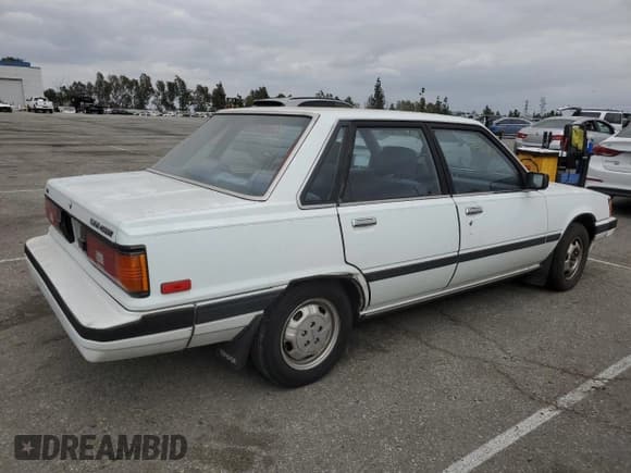✅ 1984 Toyota Camry LE • VIN: JT2SV16E3E0220882 • Lot: 53514345. Wystawiony na Copart z przebiegiem 112 430 mil. Bezpłatny archiwum sprzedaży aukcyjnych z USA i szczegółowy raport historii pojazdu na DreamBid. Zdjęcie 3.