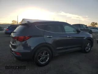 ✅ 2017 Hyundai Santa Fe 2.4L • VIN: 5NMZUDLB9HH016242 • Лот: 91452815. Опубликован ранее на Copart с пробегом 128 519 миль. Бесплатный доступ к архиву аукционных продаж из США и подробный отчёт об истории автомобиля на DreamBid. Изображение 3.