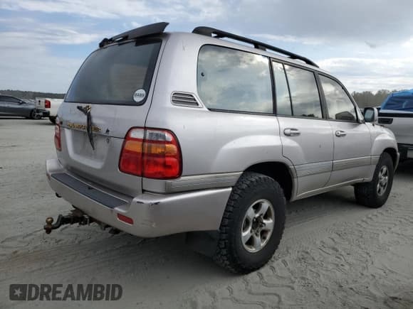 ✅ 1999 Toyota Land Cruiser • VIN: JT3HT05JXX0040905 • Lot: 75091644. Listed on Copart with 272,102 mi. Free auction sales archive from the USA and detailed vehicle history report at DreamBid. Image 3.
