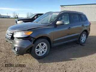 2012 Hyundai Santa Fe GLS с VIN 5XYZGDAG7CG144858, выставлен на аукционе Copart как лот 89706175 с пробегом 219 169 миль миль и Списание • Salvage title. История ставок и продаж доступна на DreamBid. Изображение 1.