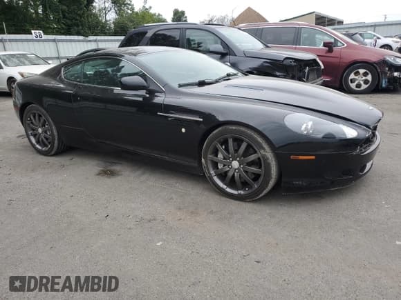 ✅ 2005 Aston Martin DB9 • VIN: SCFAD01A55GA01163 • Lot: 63708663. Wystawiony na Copart z przebiegiem 44 924 mil. Bezpłatny archiwum sprzedaży aukcyjnych z USA i szczegółowy raport historii pojazdu na DreamBid. Zdjęcie 4.