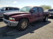 ✅ 2000 Dodge Dakota Sport • VIN: 1B7GL2AN4YS720364 • Lot: 68598355. Listed on Copart with 264,504 mi. Free auction sales archive from the USA and detailed vehicle history report at DreamBid. Image 1.