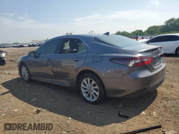 2023 Toyota Camry LE с VIN 4T1C11BK0PU083345, выставлен на аукционе Copart как лот 65721765 с пробегом Не указан миль и Списание • Salvage title. История ставок и продаж доступна на DreamBid. Изображение 2.