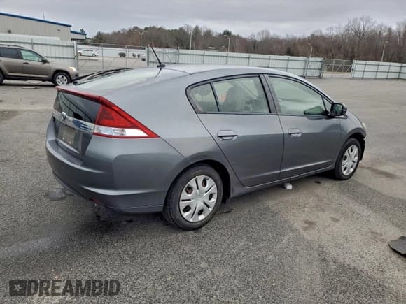 ✅ 2014 Honda Insight • VIN: JHMZE2H37ES002695 • Lot: 95284125. Listed on Copart with 122,869 mi. Free auction sales archive from the USA and detailed vehicle history report at DreamBid. Image 3.