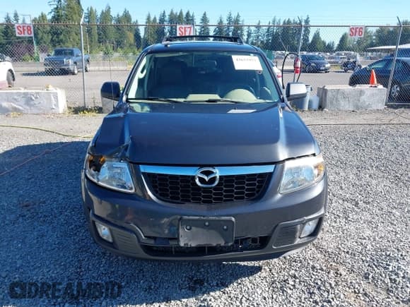 ✅ 2009 Mazda Tribute Touring • VIN: 4F2CZ92749KM09296 • Lot: 42652957. Listed on IAAI with 183,154 mi. Free auction sales archive from the USA and detailed vehicle history report at DreamBid. Image 12.