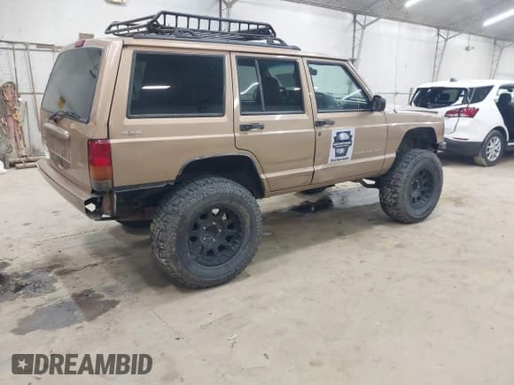 ✅ 2000 Jeep Cherokee • VIN: 1J4FF48S8YL137505 • Lot: 43400794. Listed on IAAI with 209,530 mi. Free auction sales archive from the USA and detailed vehicle history report at DreamBid. Image 4.