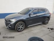 ✅ 2018 BMW X1 xDrive28i • VIN: WBXHT3C36J5K23913 • Lot: 84020025. Listed on Copart with 107,526 mi. Free auction sales archive from the USA and detailed vehicle history report at DreamBid. Image 1.