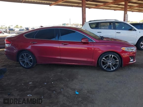 ✅ 2019 Ford Fusion Titanium • VIN: 3FA6P0D92KR184557 • Lot: 43599240. Wystawiony na IAAI z przebiegiem 130 833 mil. Bezpłatny archiwum sprzedaży aukcyjnych z USA i szczegółowy raport historii pojazdu na DreamBid. Zdjęcie 13.