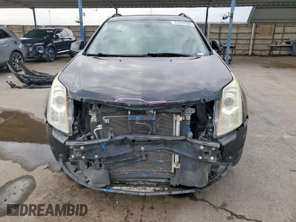 ✅ 2015 Cadillac SRX • VIN: 3GYFNAE37FS509115 • Лот: 85842335. Опубликован ранее на Copart с пробегом 83 192 миль. Бесплатный доступ к архиву аукционных продаж из США и подробный отчёт об истории автомобиля на DreamBid. Изображение 5.
