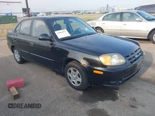 2005 Hyundai Accent GLS with VIN KMHCG45C55U587584, listed as a IAAI auction lot 42864972 with 122,849 mi miles and . Bid and sale history available at DreamBid. Image 1.