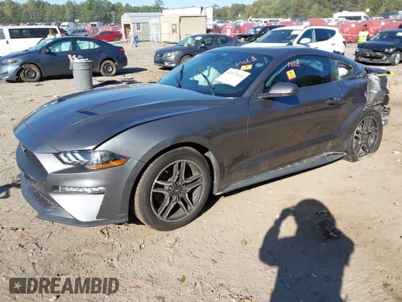 ✅ 2021 Ford Mustang EcoBoost • VIN: 1FA6P8TH8M5134940 • Lot: 43373024. Listed on IAAI with 55,343 mi. Free auction sales archive from the USA and detailed vehicle history report at DreamBid. Image 2.
