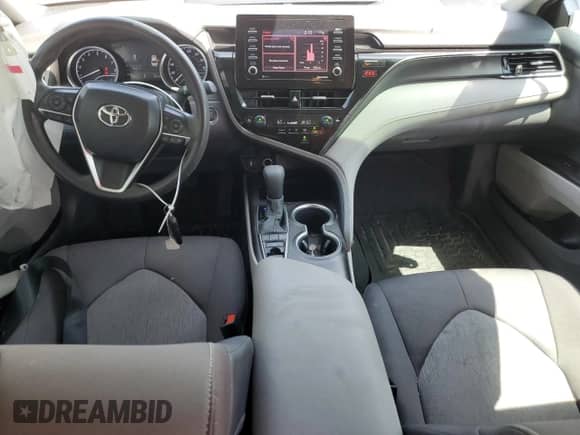 2022 Toyota Camry LE с VIN 4T1R11BK7NU055288, выставлен на аукционе Copart как лот 67012075 с пробегом 106 728 миль миль и Списание • Salvage title. История ставок и продаж доступна на DreamBid. Изображение 8.