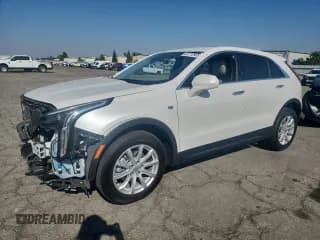 ✅ 2021 Cadillac XT4 FWD Luxury • VIN: 1GYAZAR46MF033829 • Лот: 82772905. Опубликован ранее на Copart с пробегом 32 628 миль. Бесплатный доступ к архиву аукционных продаж из США и подробный отчёт об истории автомобиля на DreamBid. Изображение 1.