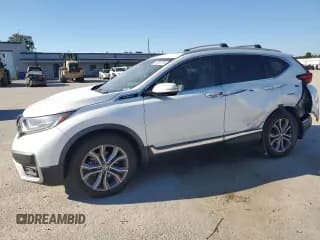 ✅ 2020 Honda CR-V Touring • VIN: 2HKRW1H93LH409745 • Лот: 90867745. Опубликован ранее на Copart с пробегом 99 374 миль. Бесплатный доступ к архиву аукционных продаж из США и подробный отчёт об истории автомобиля на DreamBid. Изображение 1.