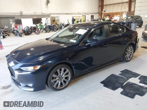 ✅ 2021 Mazda 3 Preferred • VIN: JM1BPBCL7M1334712 • Lot: 43160500. Listed on IAAI with 57,546 mi. Free auction sales archive from the USA and detailed vehicle history report at DreamBid. Image 2.