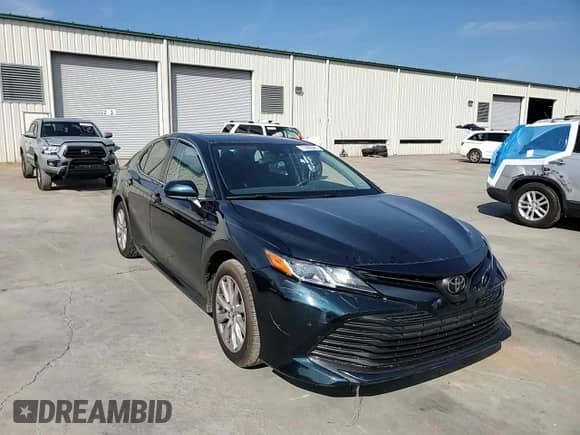2019 Toyota Camry LE z VIN 4T1B11HK8KU822036, wystawiony jako Copart lot #71805945 z przebiegiem 106 584 mil mil oraz Szkoda całkowita • Salvage title. Historia ofert i sprzedaży dostępna na DreamBid. Obrazek 13.