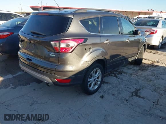 ✅ 2017 Ford Escape SE • VIN: 1FMCU0GD5HUC12659 • Lot: 43813526. Listed on IAAI with 173,004 mi. Free auction sales archive from the USA and detailed vehicle history report at DreamBid. Image 4.