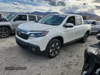 ✅ 2019 Honda Ridgeline RTL-T • VIN: 5FPYK3F69KB002688 • Lot: 71927445. Listed on Copart with 125,619 mi. Free auction sales archive from the USA and detailed vehicle history report at DreamBid. Image 1.