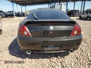 2004 Hyundai Tiburon GS z VIN KMHHM65D44U112560, wystawiony jako Copart lot #50506165 z przebiegiem 251 237 mil mil oraz Czysty tytuł • Clean title. Historia ofert i sprzedaży dostępna na DreamBid. Obrazek 6.