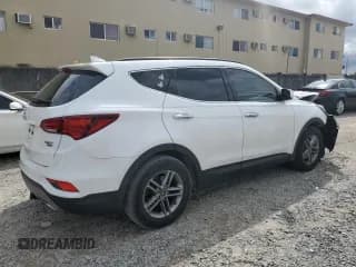 ✅ 2018 Hyundai Santa Fe 2.4L • VIN: 5NMZUDLB4JH104458 • Лот: 70008413. Опубликован ранее на Copart с пробегом 56 961 миль. Бесплатный доступ к архиву аукционных продаж из США и подробный отчёт об истории автомобиля на DreamBid. Изображение 3.