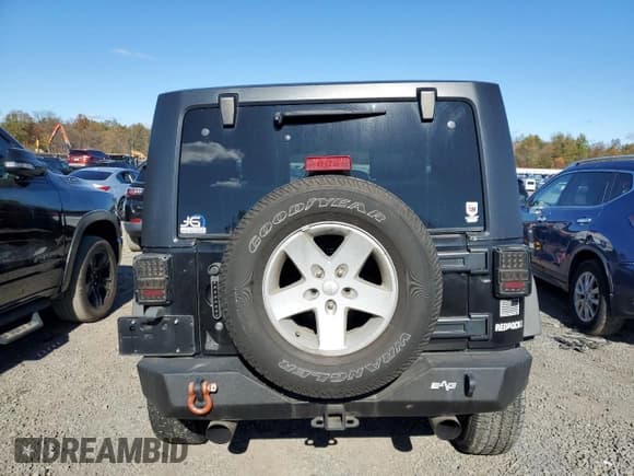 ✅ 2009 Jeep Wrangler X • VIN: 1J4FA24109L789584 • Lot: 82713155. Listed on Copart with 133,299 mi. Free auction sales archive from the USA and detailed vehicle history report at DreamBid. Image 6.