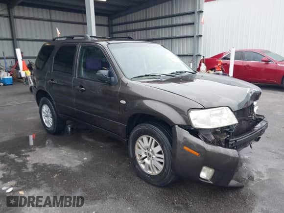 2005 Mercury Mariner Luxury z VIN 4M2YU56195DJ14917, wystawiony jako IAAI lot #41538962 z przebiegiem 210 486 mil mil oraz . Historia ofert i sprzedaży dostępna na DreamBid. Obrazek 1.