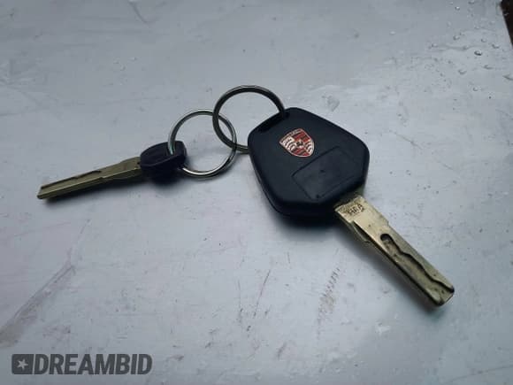 ✅ 1999 Porsche 911 • VIN: WP0CA2997XS655018 • Lot: 41778688. Listed on IAAI with 196,760 mi. Free auction sales archive from the USA and detailed vehicle history report at DreamBid. Image 11.