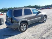 ✅ 2005 Mazda Tribute i • VIN: 4F2YZ02Z65KM48274 • Lot: 43129870. Listed on IAAI with 144,826 mi. Free auction sales archive from the USA and detailed vehicle history report at DreamBid. Image 4.